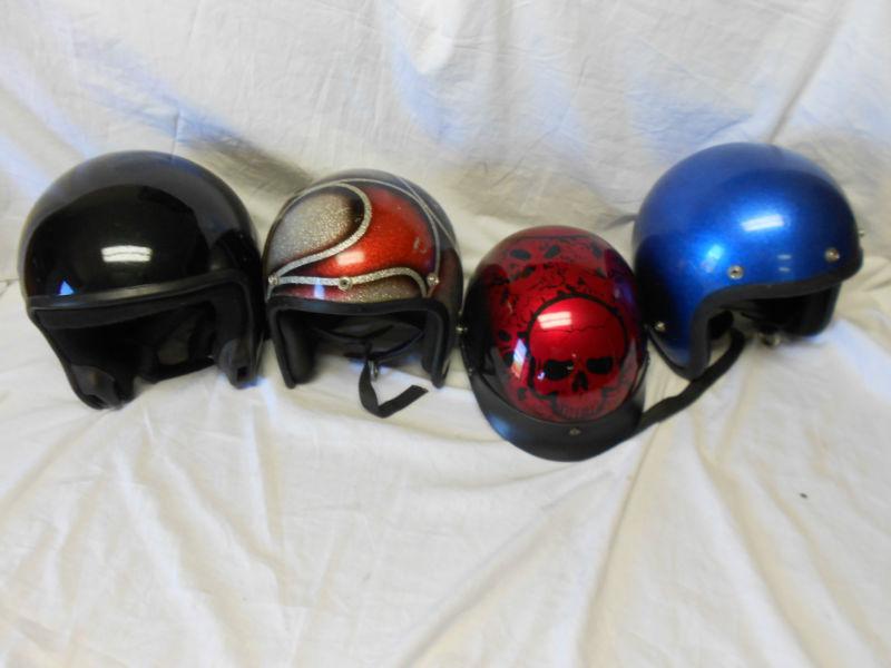 Four motorcycle helmets