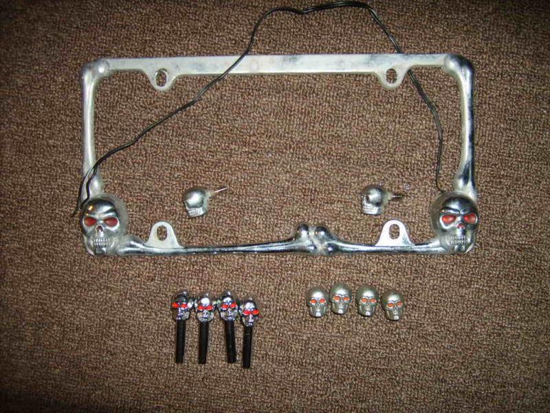 Skull license plate holder w/ lit eyes, skull door knobs, skull valve stems