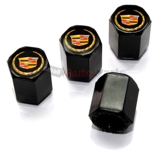 (4) cadillac new style gold logo black abs tire/wheel stem air valve caps set