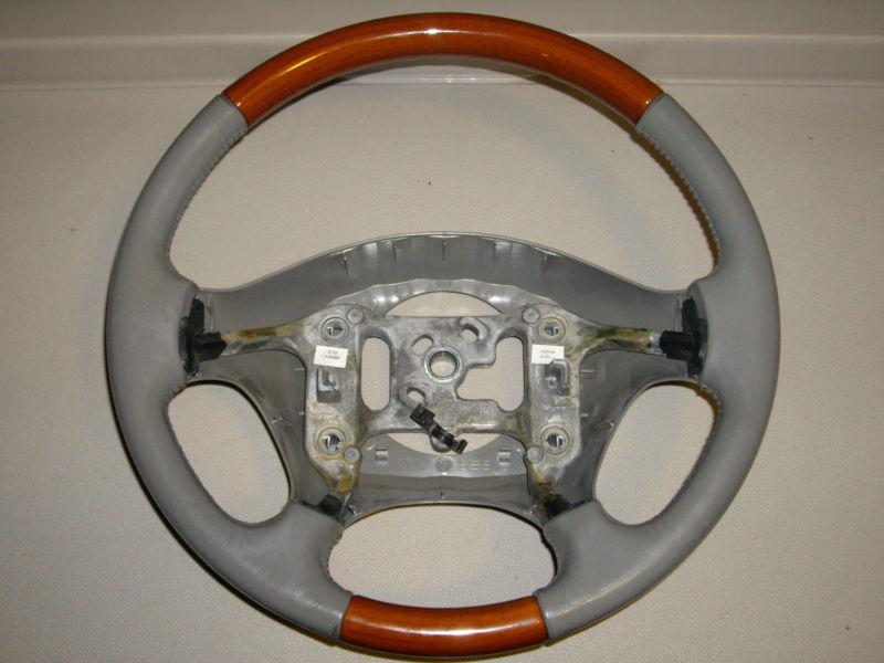 Light grey cadillac seville sls sts leather and wood grain steering wheel