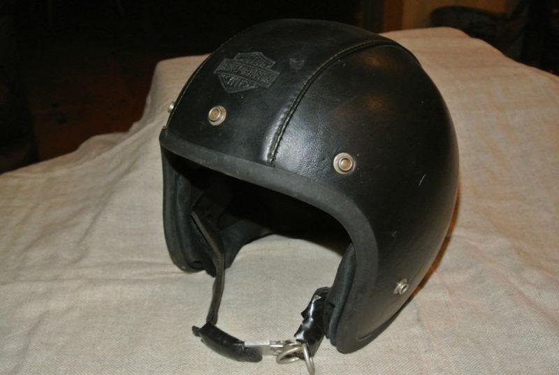 Vintage harley-davidson black leather clad motorcycle helmet,  
