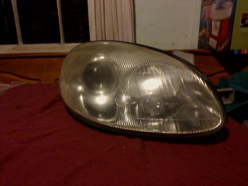 99 1999 daewoo leganza front right passenger side headlight capsule assembly