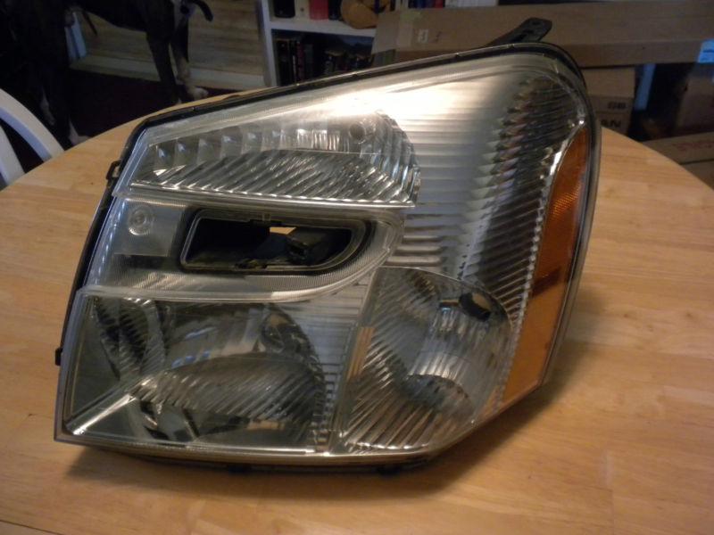 2005 chevrolet equinox headlight  o.e.m.