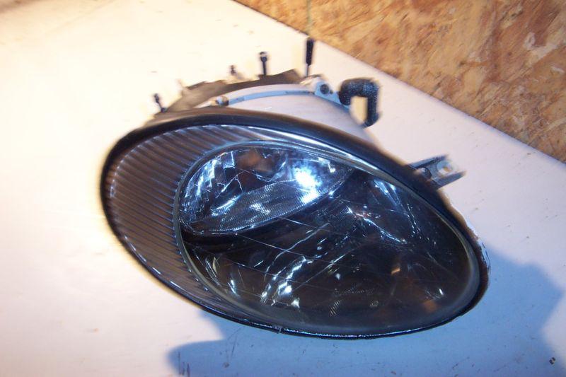 Ford taurus 98-99 headlight passenger side stock