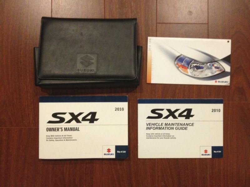 10-2010 suzuki sx4 owner's manual with books and black leather case.