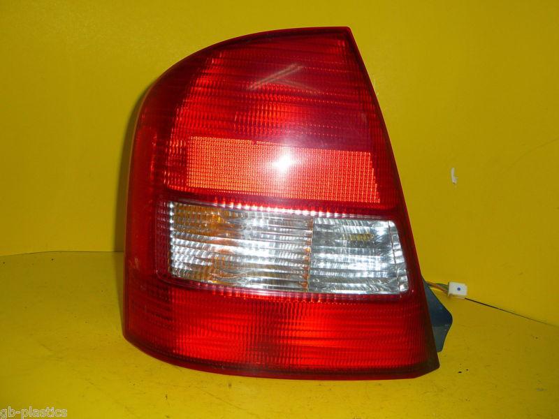 Mazda protege 99 00 01 02 03 driver side tail light - little crack on front