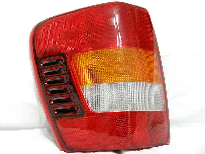 Jeep 02-04 grand cherokee rear tail light lamp l driver side w/circuit board new