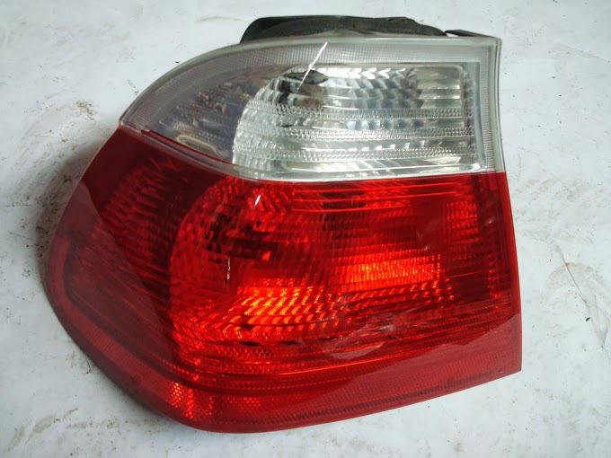 Bmw 63218364921 oem used e46 sedan clear left rear tail light lamp 330i 325xi 