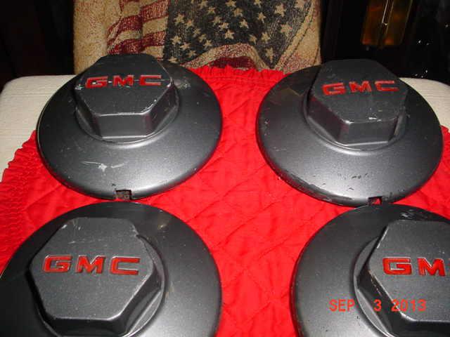 Gmc- 95 to 99 oem dark gray wheel center caps- set of 4- 15661028