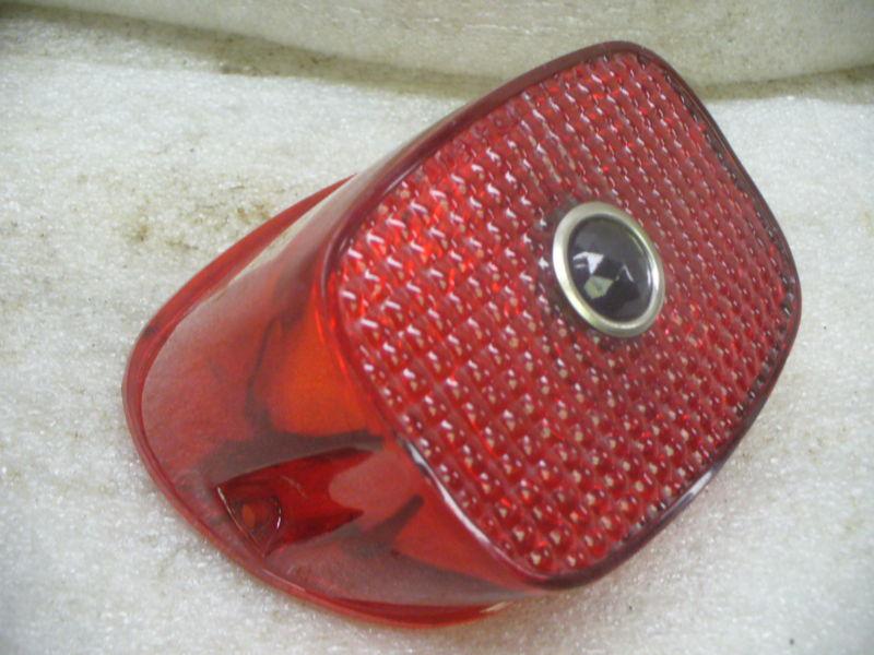 Harley 84-99 red plastic tail lamp lens with blue jeweled dot center.