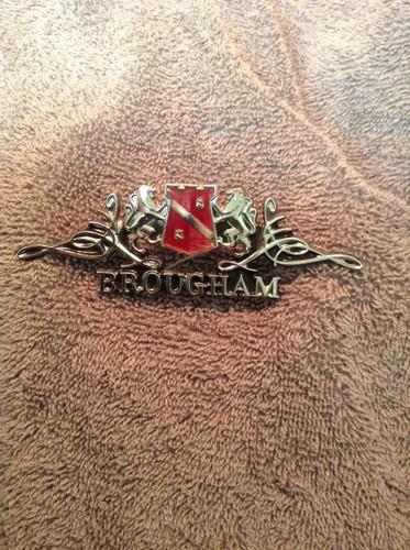 Cadillac brougham emblem 