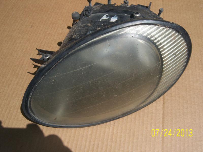 1996 ford taurusn left side headlight assembly (1 mounting tab broken)