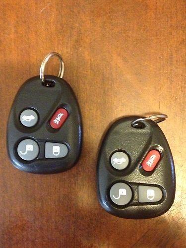 A pair of new gm keyless entry fob transmitters with batteries