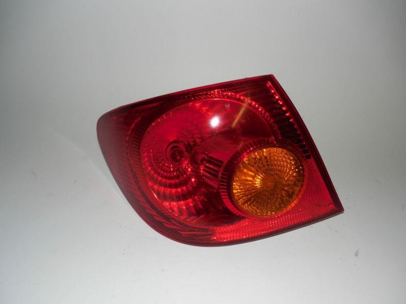 03 04 toyota corolla oem left tail light nice!