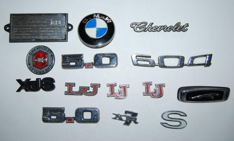 Lot of 14 assorted car emblems - continental, chevrolet, bmw, jaguar - xx