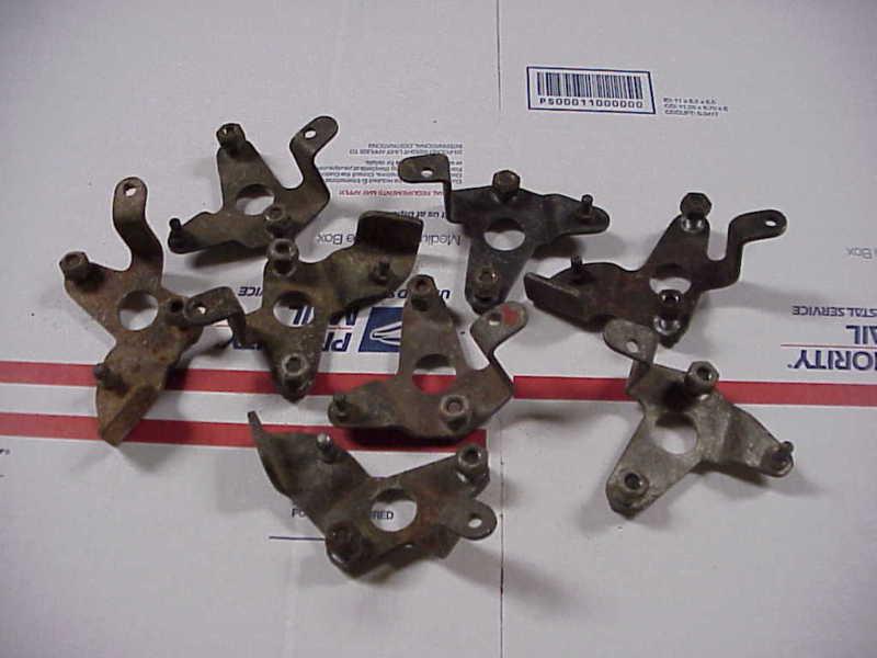 Early pontiac quadra-jet carburetor throttle cable brackets group of 8  off carb