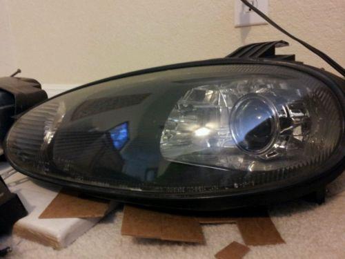 Mazda miata driver side headlight with retrofit