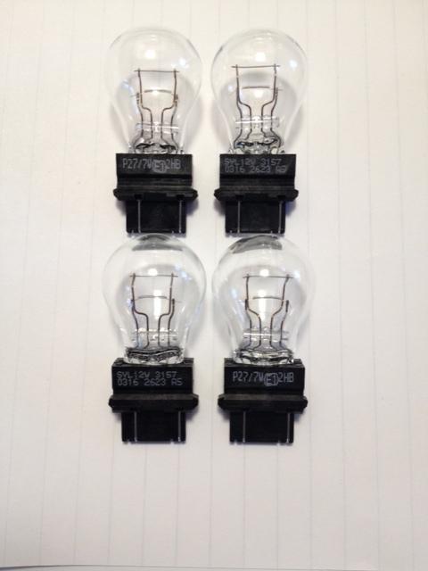 Sylvania 3157 tail light/turn signal  **set of 4**. genuine oem quality