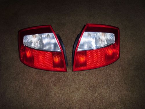 Audi a4 tail light set w/ bulbs - original hella - 8e0 945 095 b + 8e0 945 096 b