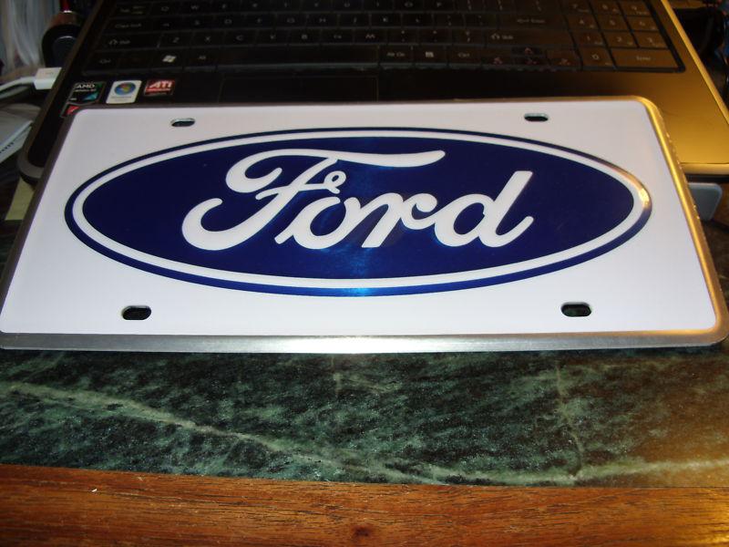 Ford oval metal license plate-product of fomoco-new!!!