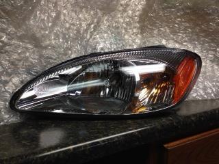 00 01 02 03 04 05 06 07 ford taurus l. headlight w/o centennial pkg