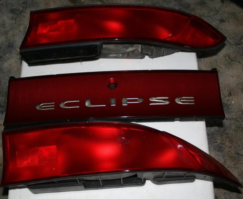  97 98 99 eclipse tail lights set stock  oem (set of 3)