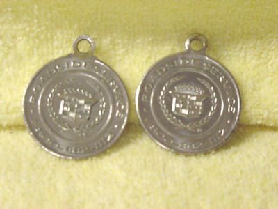 Cadillac &#034; silver  &#034; key chain disc&#039;s [2] 1990&#039;s gold key delivery--used orig