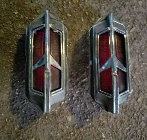 Two (2) oem 1968 1969 oldsmobile rear side marker emblem rocket lights lamps