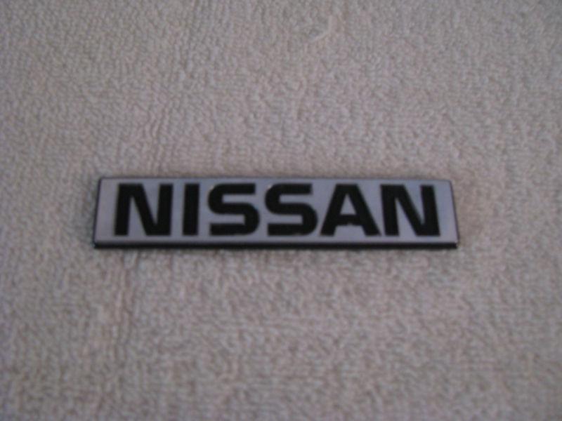 1984-89 nissan 300zx rear trunk hatch lid left side nissan chrome emblem oem