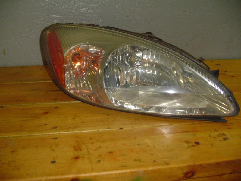 Ford taurus front head lamp assembly