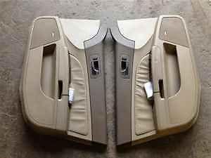 05 06 07 cadillac sts pair of front door trim pads oem