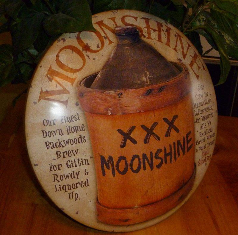 Moonshine alcohol metal sign hubcap shape booze gittin' liquored up garage man