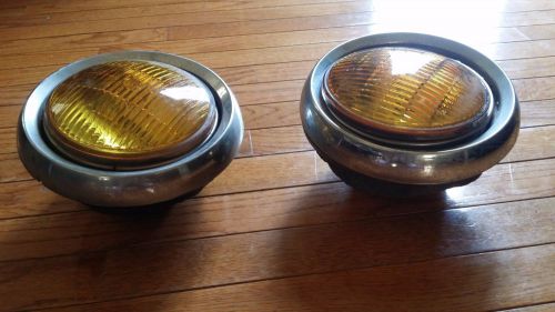 Pair of vintage yellow fog lights with frames/buckets