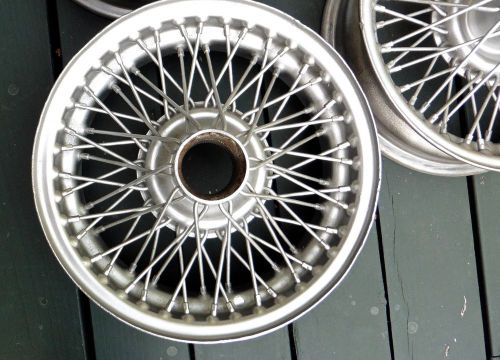 Mgb&#039;  steel wire wheels,  made in england ...4 1/2 x 14, ( set of 4 )