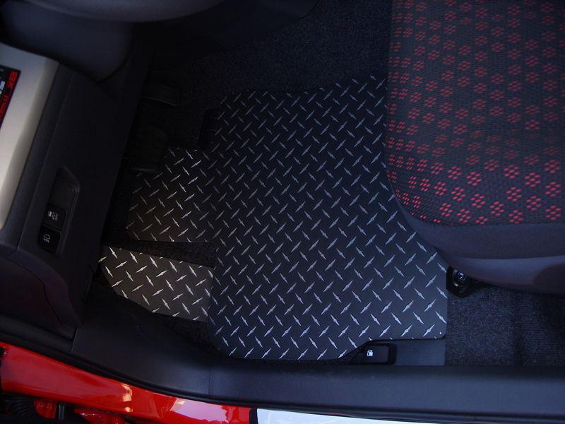 Xb 08-13  floor mats.  black with exposed metal/silver diamonds. front and back