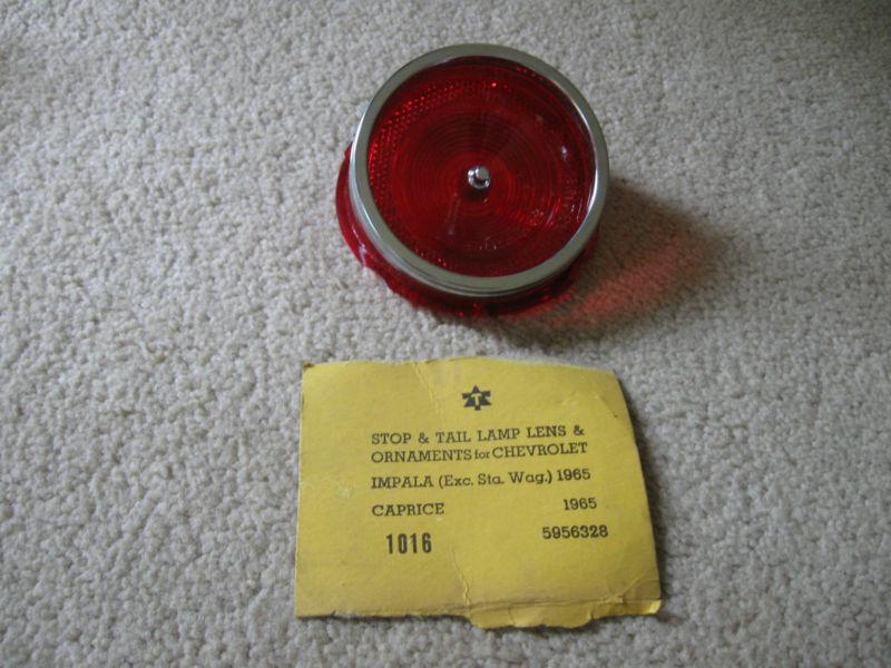 1965 chevy impala-caprice tail light lens with trim. new! glo-brite.  