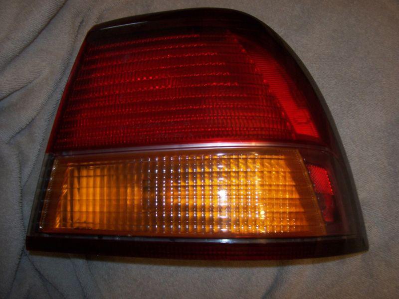 97 98 99 nissan maxima passenger right tail light lamp  oem outer stock #2