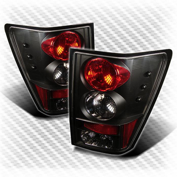 05 06 jeep grand cherokee black altezza tail lights rear brake lamp pair new set