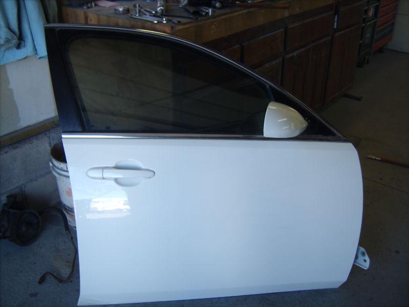 Passenger side front door, window, and door panel.