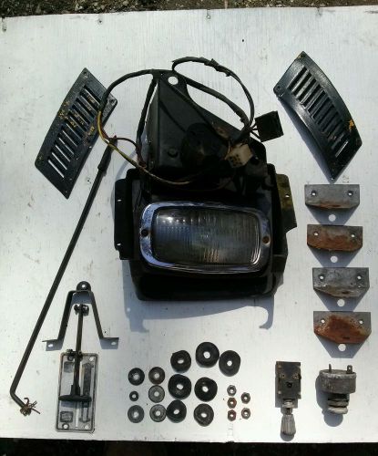 69`tnt skidoo headlight assembly,hood parts, ignition switch, etc.