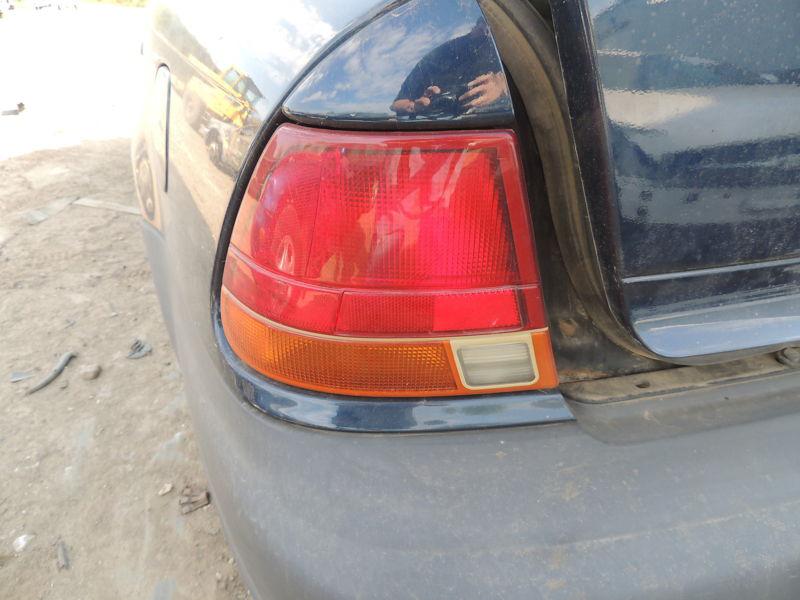 97 98 99 saturn s series sedan l. tail light sdn quarter panel mounted 428162