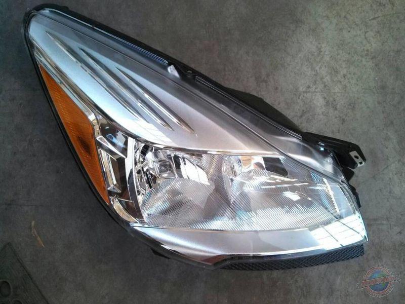 Headlight  escape 1218264 13 new oem surplus  no bulbs  nice