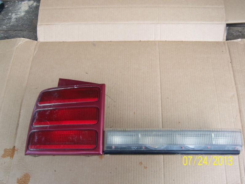 1996 olds cutlass ciera left side tail light (missing red reflector strip)