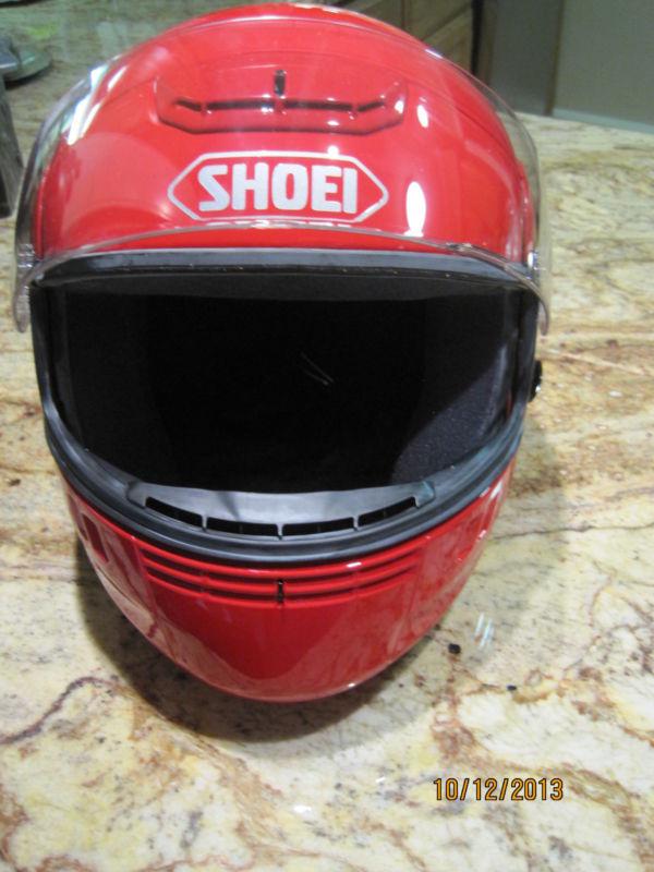 Glossy red shoei syncrotec motorcycle helmet