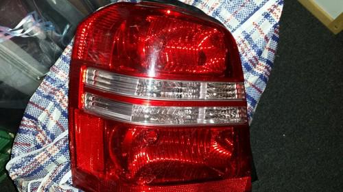 Toyota highlander left rear tail light. 01-03... 03