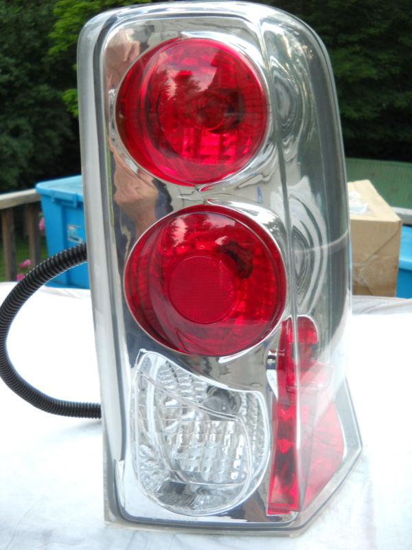 02-06 cadillac escalade euro clear chrome rh tail light rear brake lamp oem used