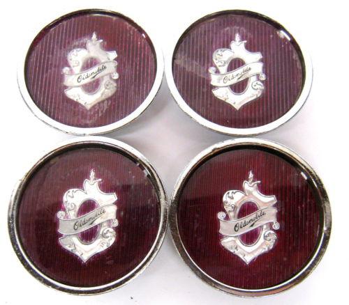 Set of 4 vintage oldsmobile wire wheel center caps