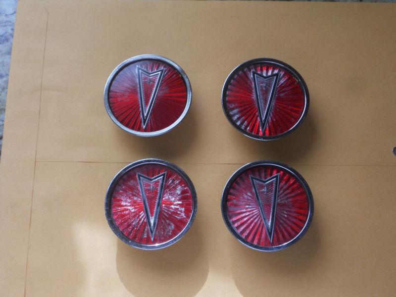 1980's pontiac wire wheel center emblem caps - 4 - red part no. 254842