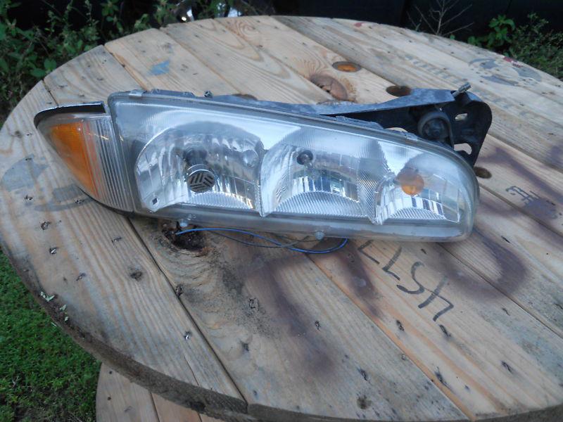 1998 98 pontiac bonneville passenger right headlight