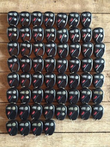 Lot of (59) gm koblear1xt keyless entry remote key fobs oem used